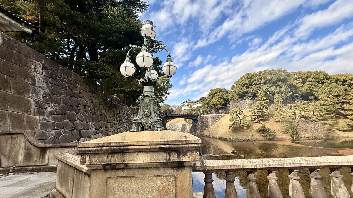 Ornate lamp post and stone bridge at the Imperial Palace in Tokyo