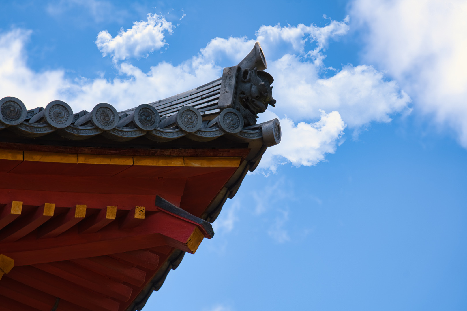 Temple roof detail against blue sky